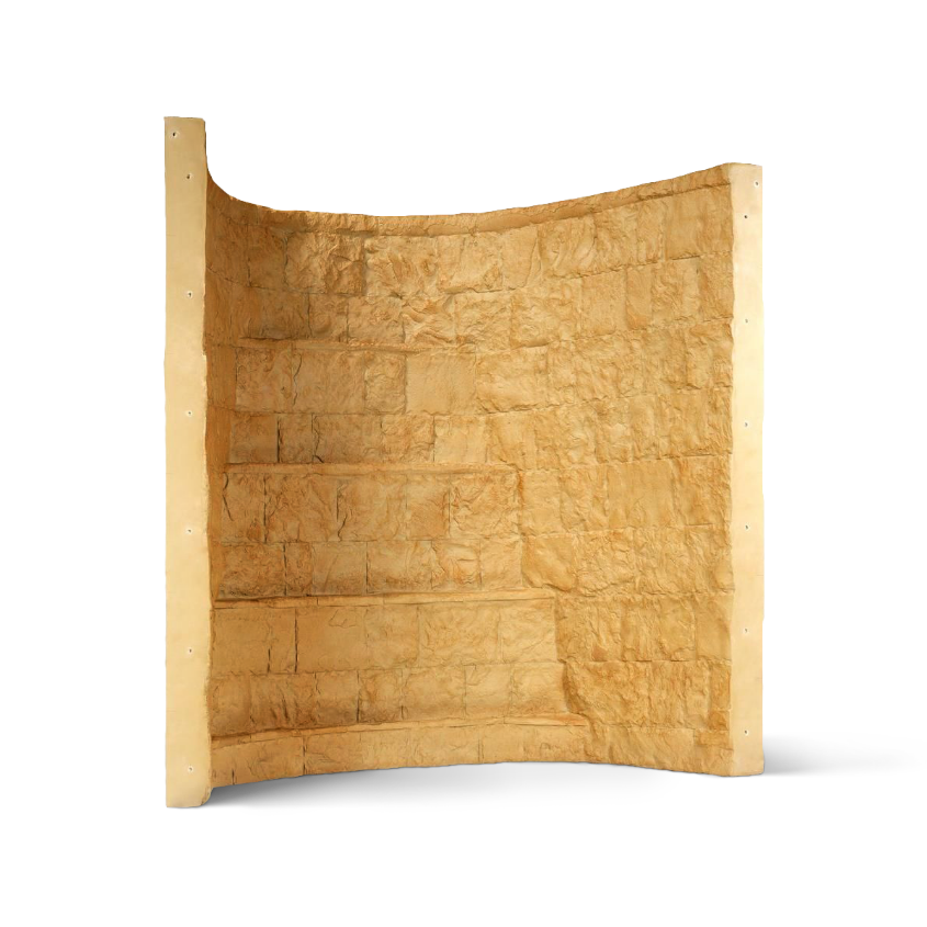 Curved section of a tan brick wall with a textured surface, possibly a sculpture.