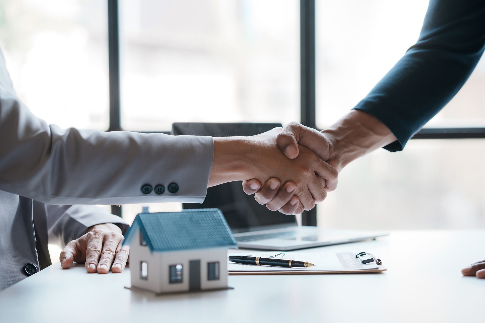 Client and Real Estate Agent Shaking Hands
