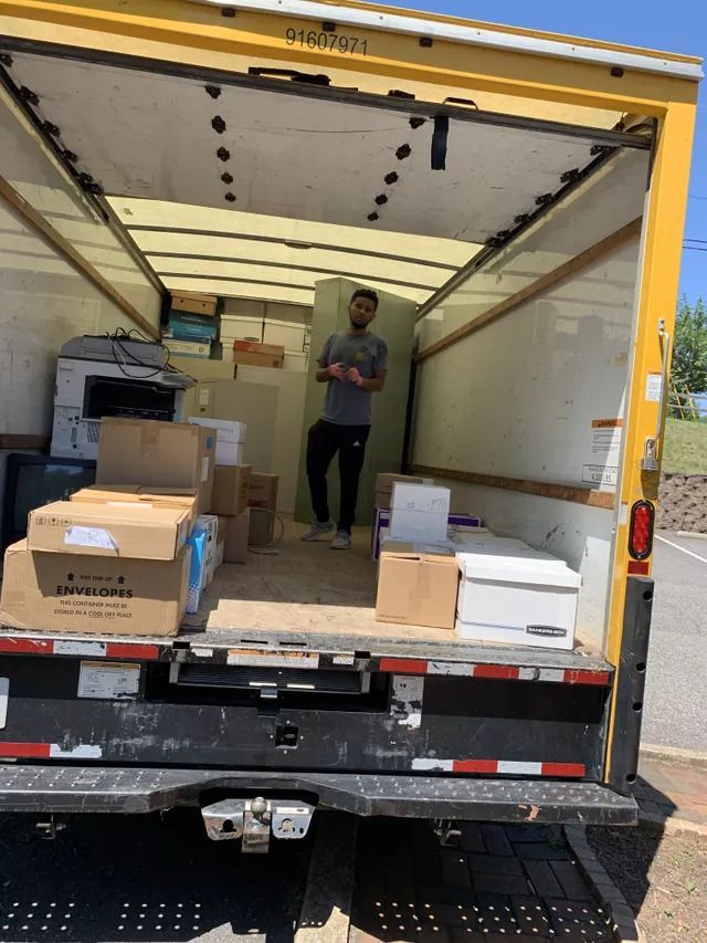 Man Loading Boxes on the Truck