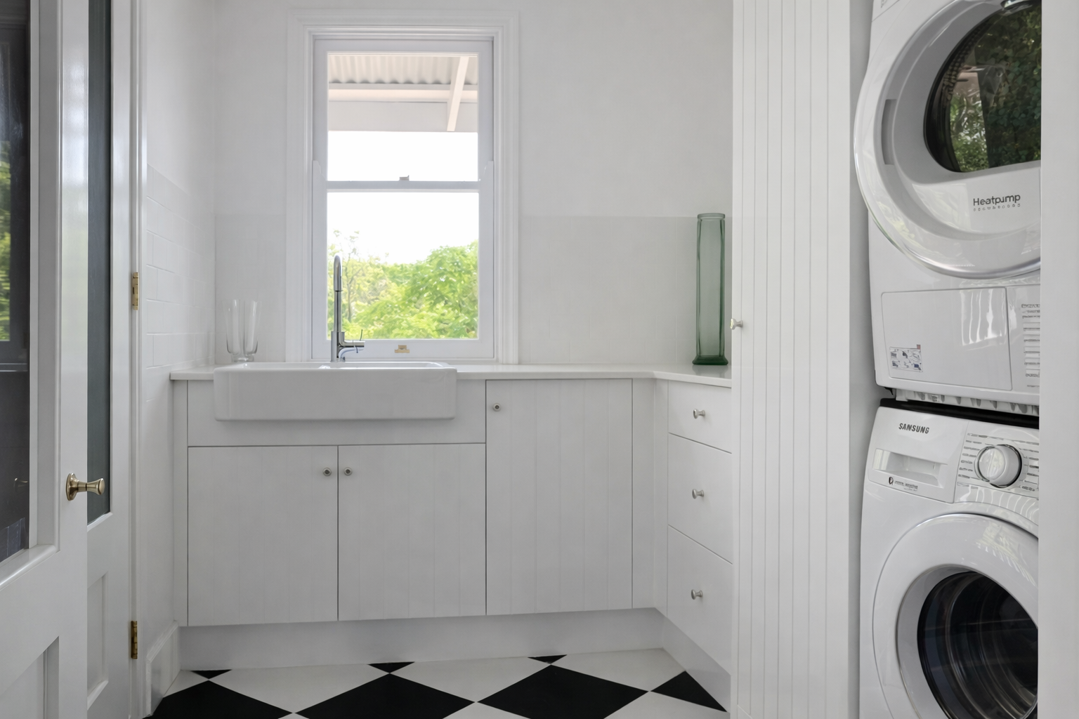 White Kitchen with Stainless Steel Fridge, Oven, and Microwave — Paul Tagget Kitchens In Goonellabah, NSW