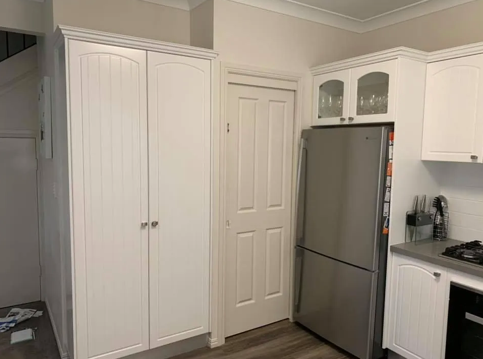 The Corner of a Kitchen, Focusing on the Large White Kitchen Cabinet