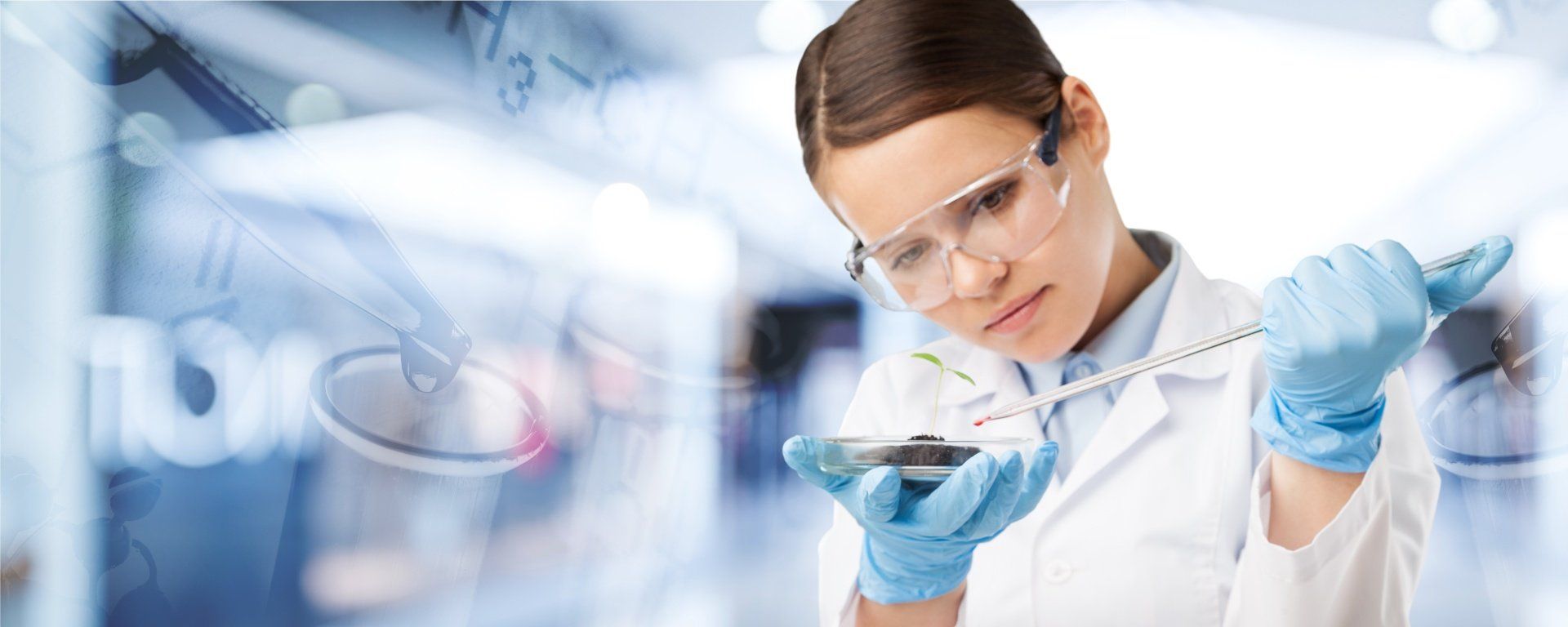 A female scientist is measuring something with a tape measure in a laboratory.