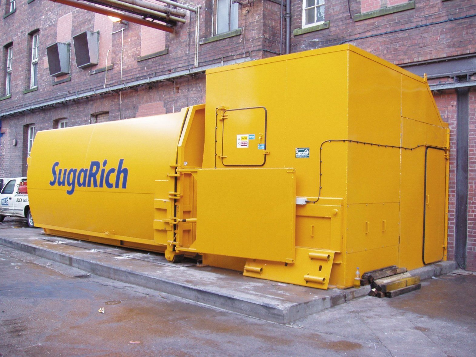 A large yellow container with sugarrich written on it