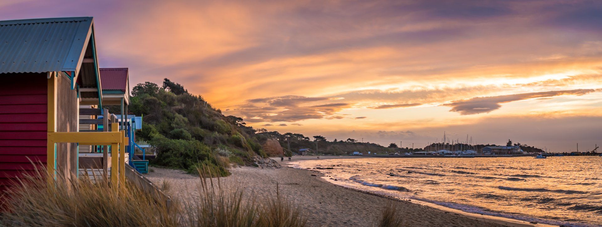 Beach Huts Line a Sandy Shore — Freedom Wealth Solutions In Mornington, VIC