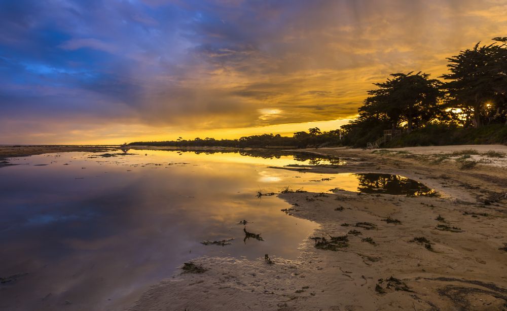 Sunset Over a Calm Beach — Freedom Wealth Solutions In Leongatha, VIC