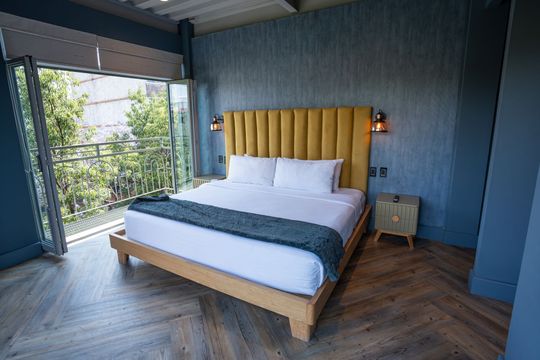 There is a large bed in the middle of the room.