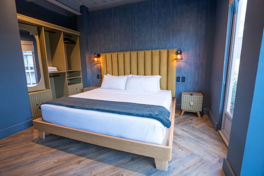 There is a large bed in the middle of the room.