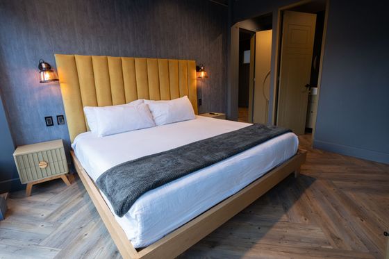 There is a large bed in the middle of the room.
