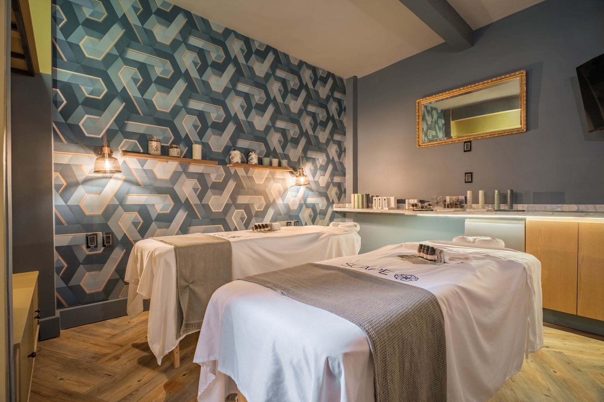 A hotel room with a king size bed , a television , a table and chairs.