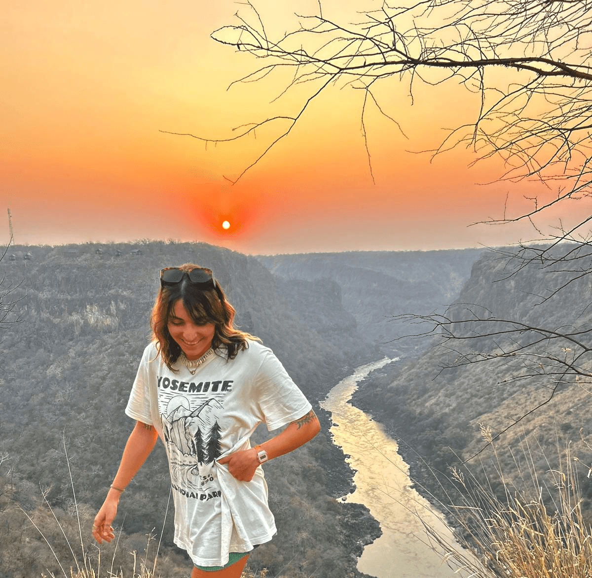 A woman wearing a t-shirt that says ' seemite ' on it