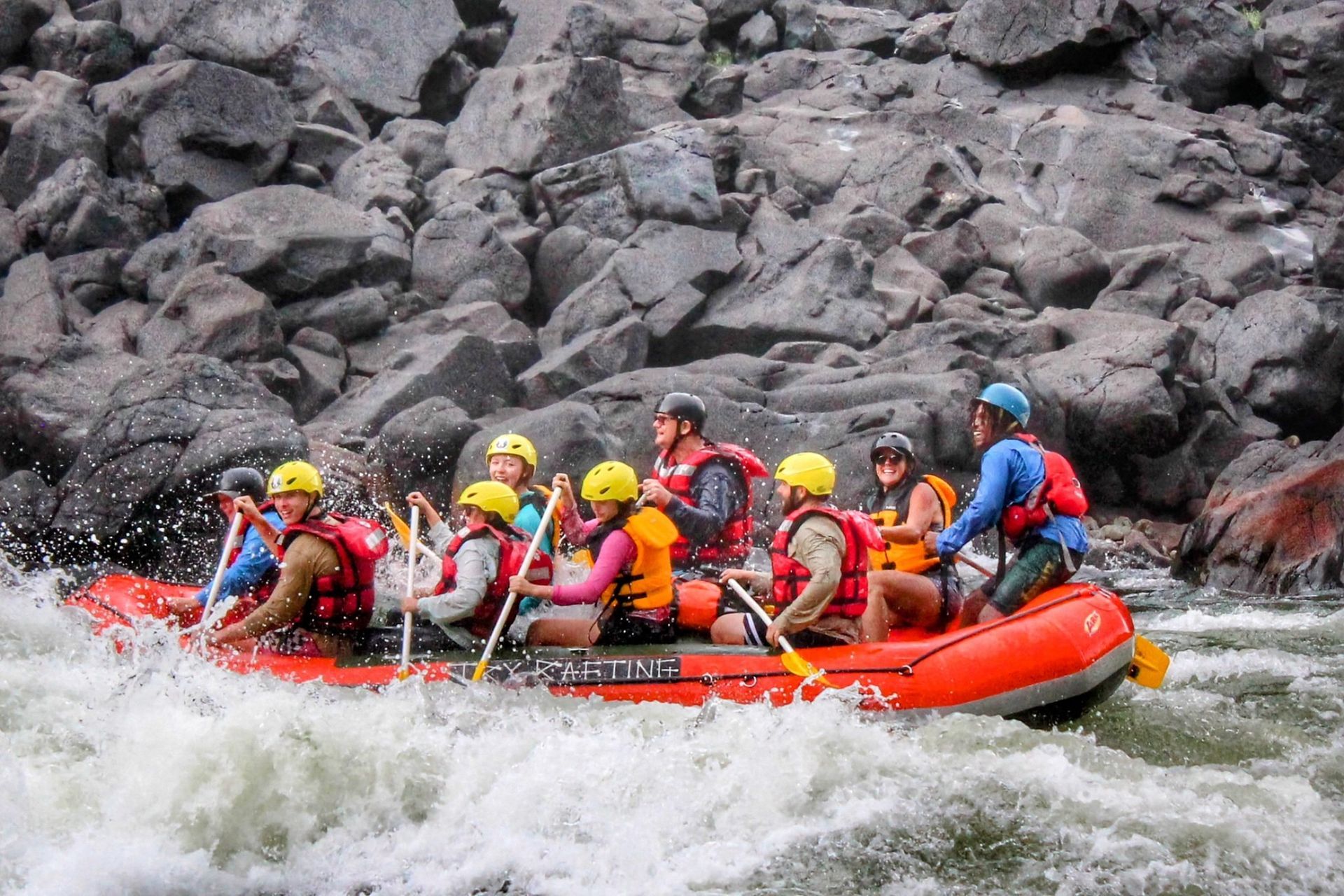 A group of people are rafting down a river.