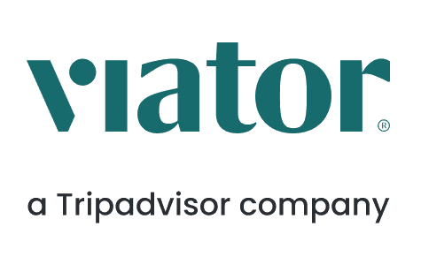 Viator logo, dark gray text with a dot over the "i". "A Tripadvisor company" appears beneath.