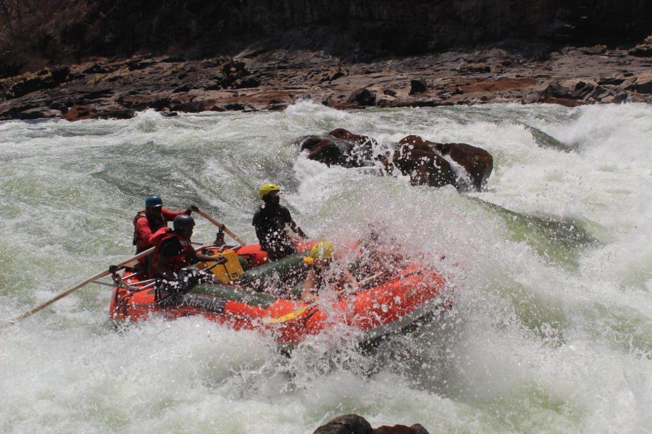 A group of people are rafting down a river.