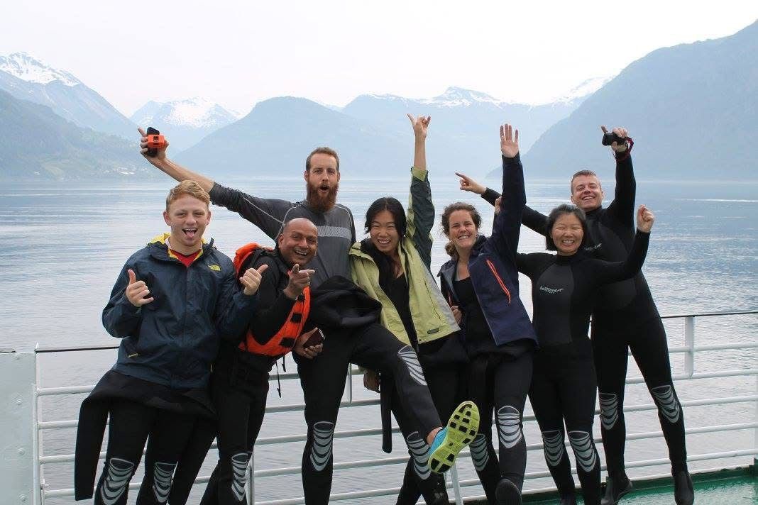 Group of friend wearing a wetsuit enjoying the trip