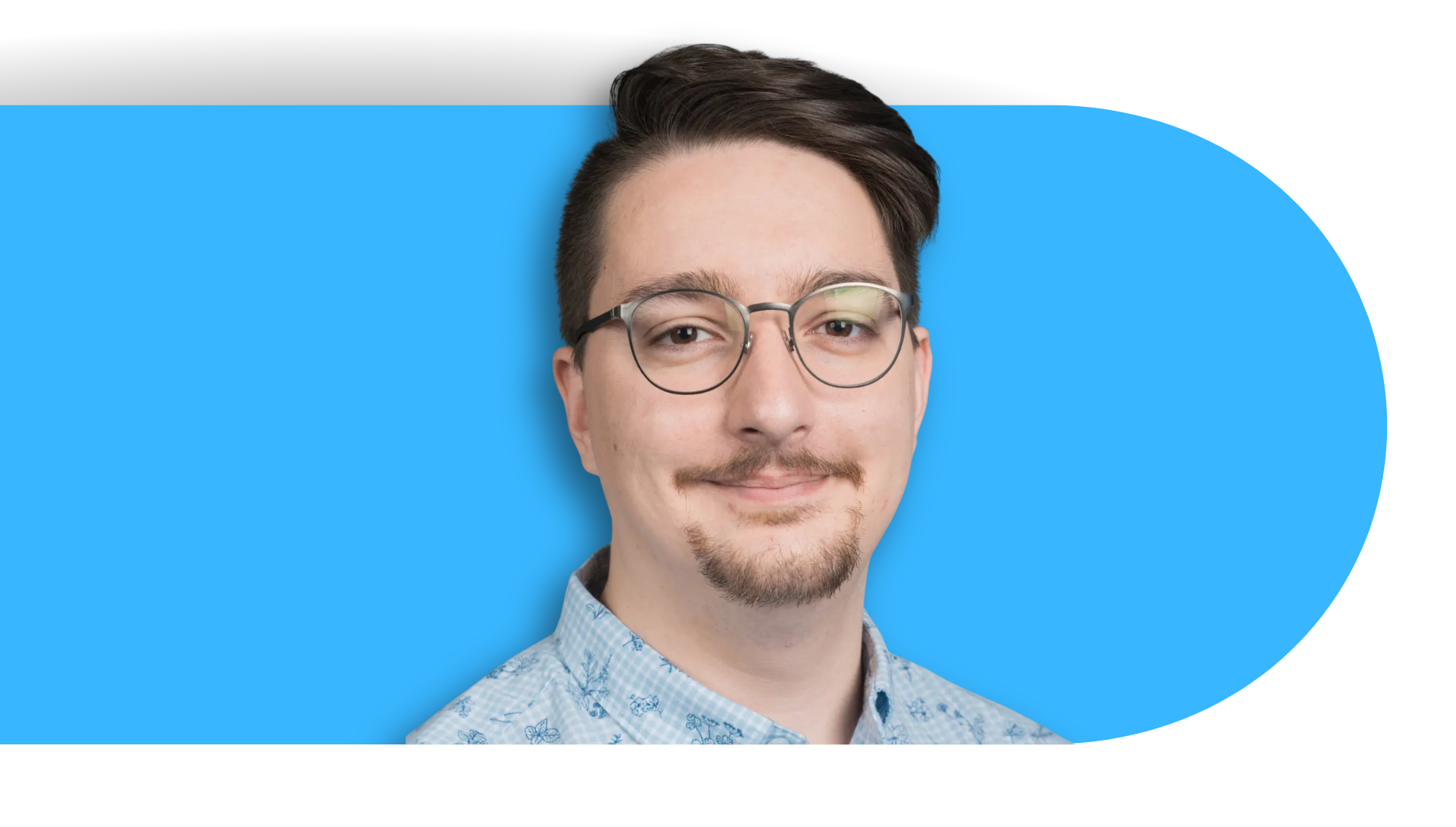 Matthew Nardozza in front of a blue background