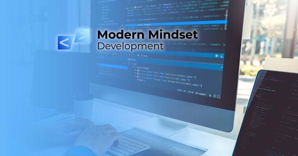 Modern Mindset Development displayed on a desktop monitor in a blue-toned workspace