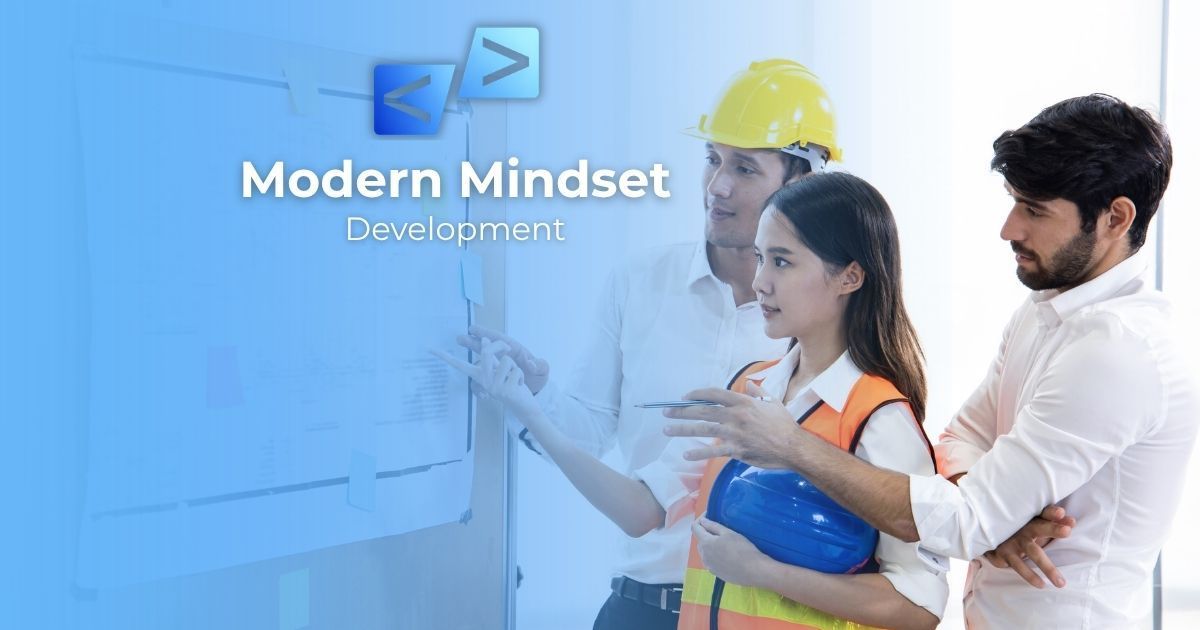 Modern Mindset presentation with three people in safety gear at a whiteboard