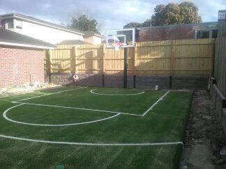 Sports field grass maintenance machine