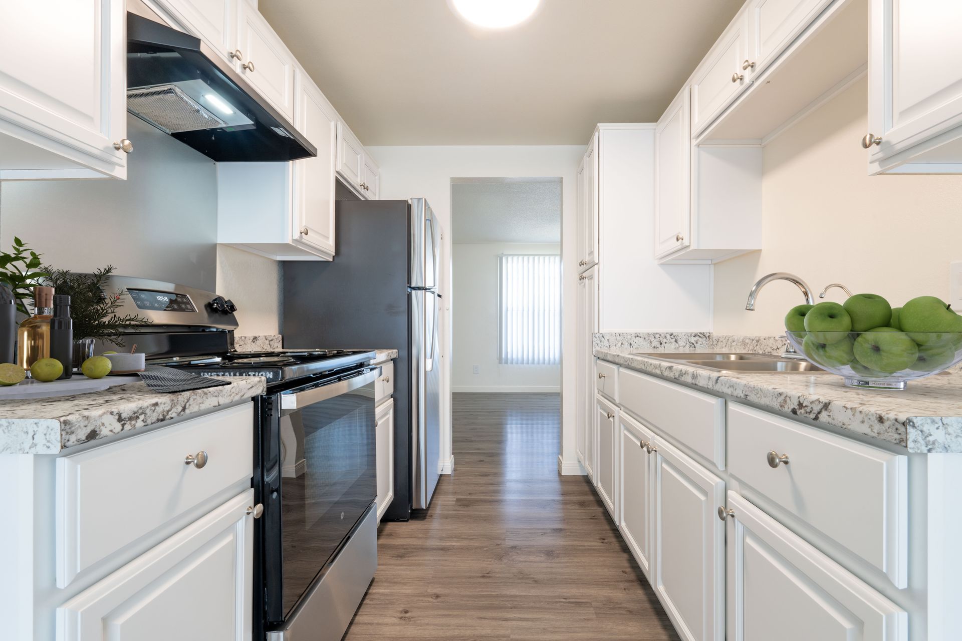 unfurnished kitchen, living, and dining areas