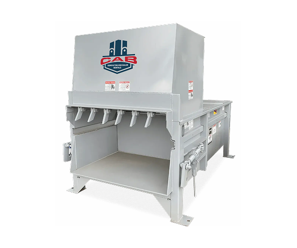 A light gray industrial waste compactor with the CAB logo on the front, showing a large loading opening.