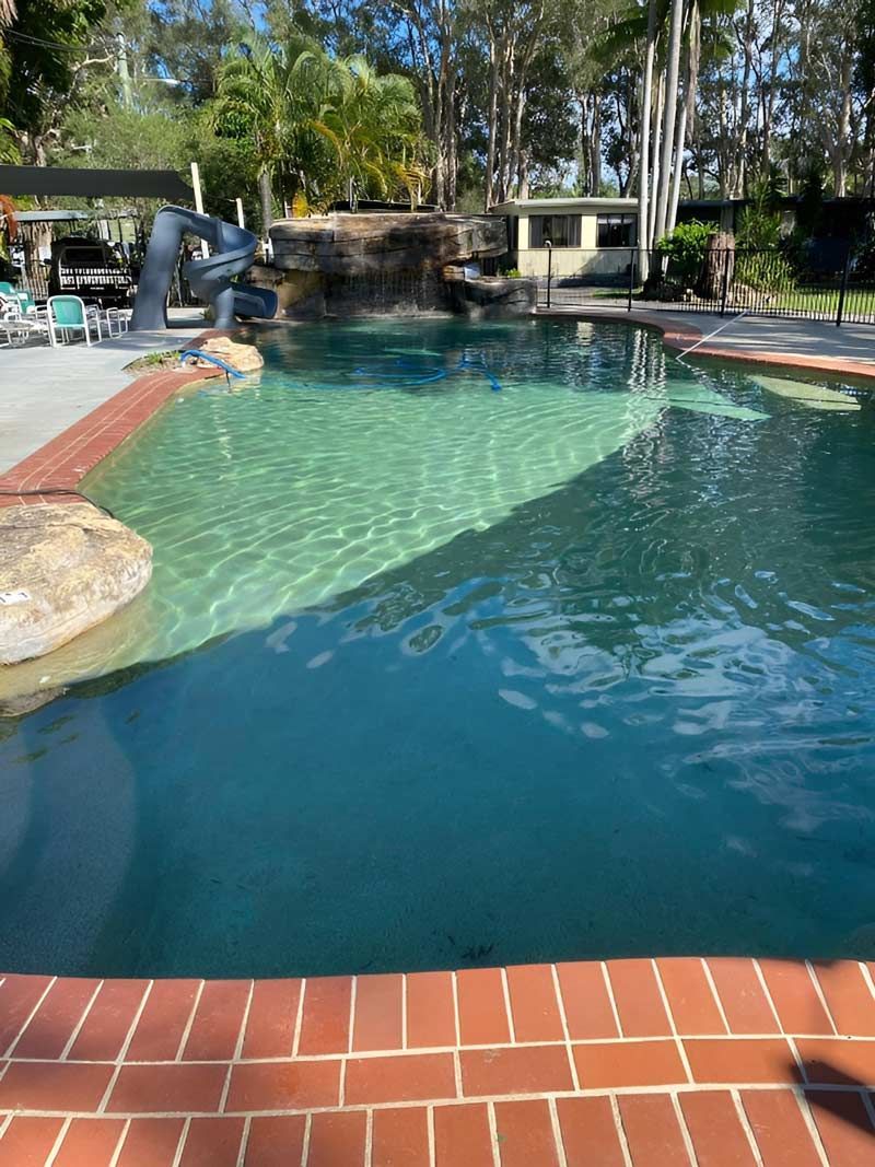 Swimming Pool Filled With Blue Water — Pool Zone in Port Macquarie, NSW
