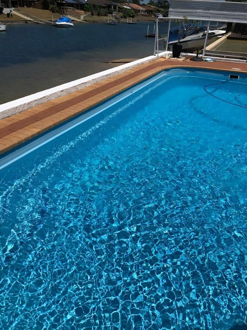 Swimming Pool Filled With Blue Water — Pool Zone in Port Macquarie, NSW