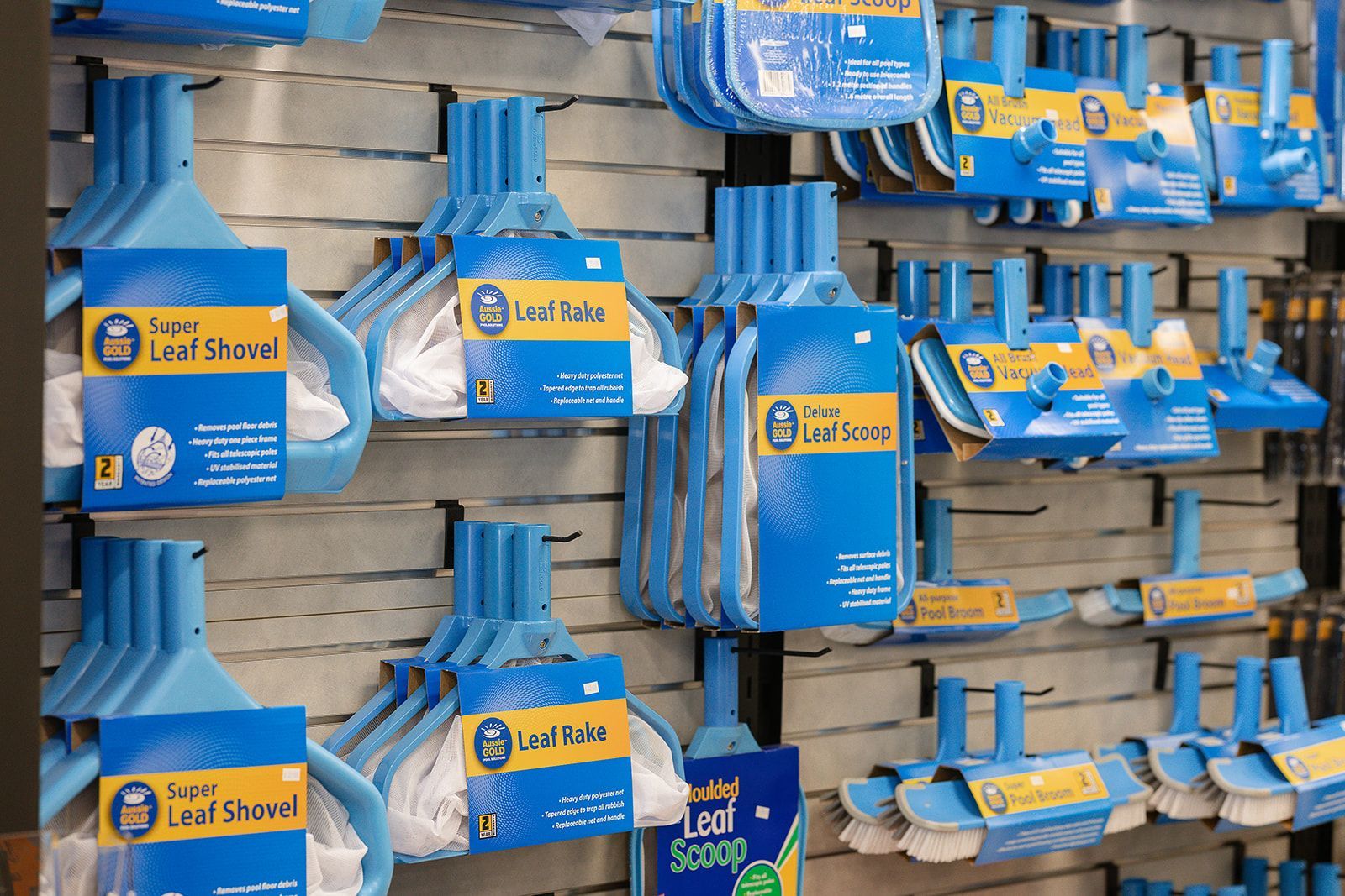 A Shelf Filled With Lots Of Swimming Pool Toys In Boxes — Pool Zone in Port Macquarie, NSW