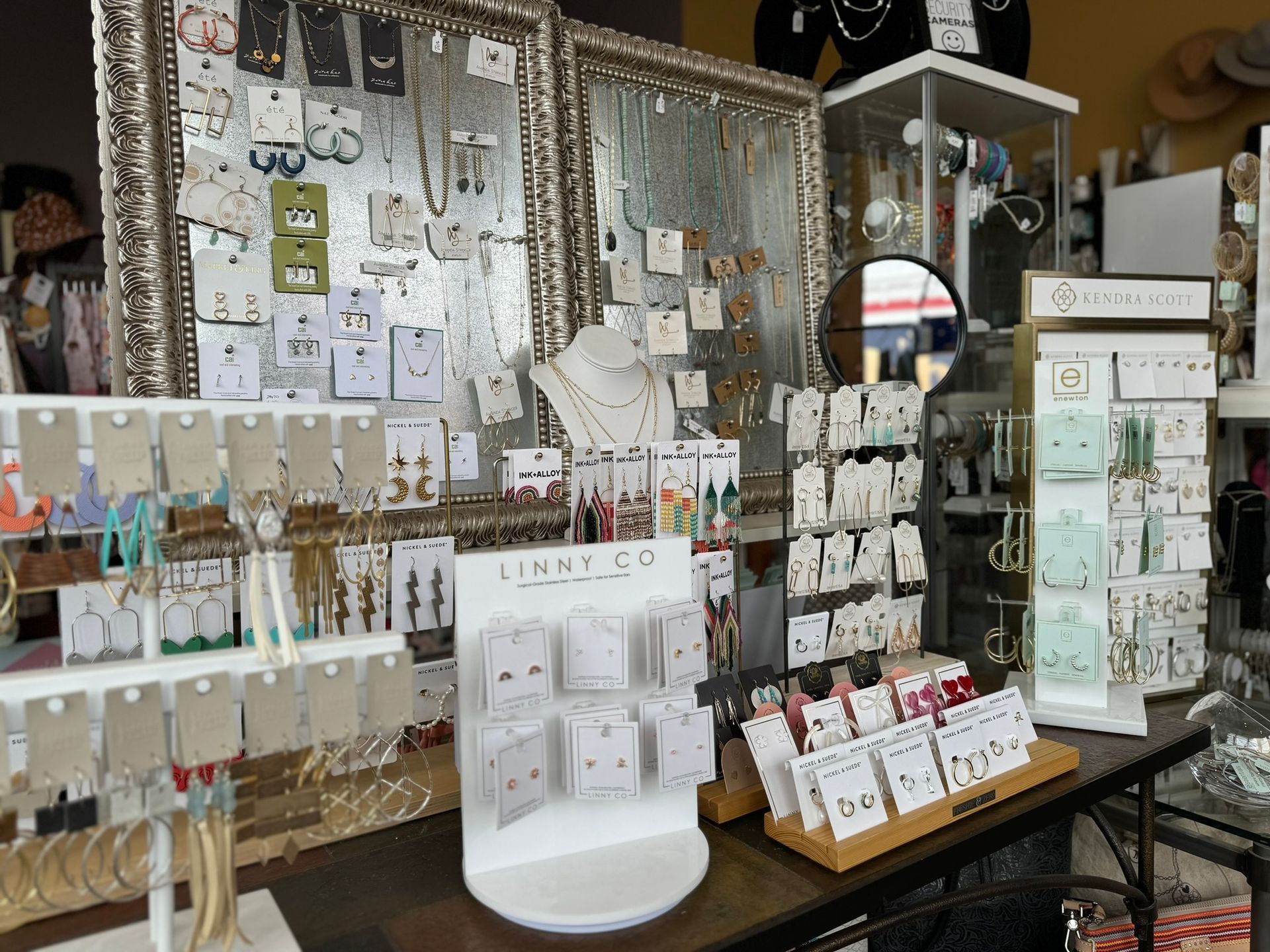 A table with a lot of jewelry on it in a store.