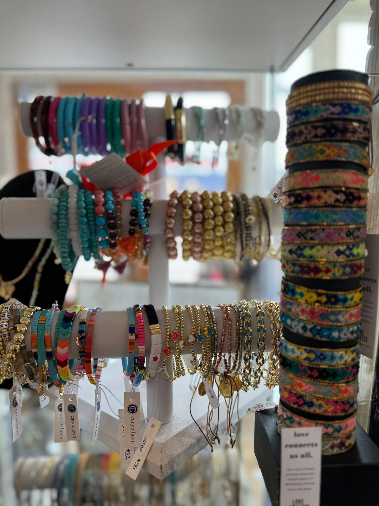 A bunch of bracelets are stacked on top of each other