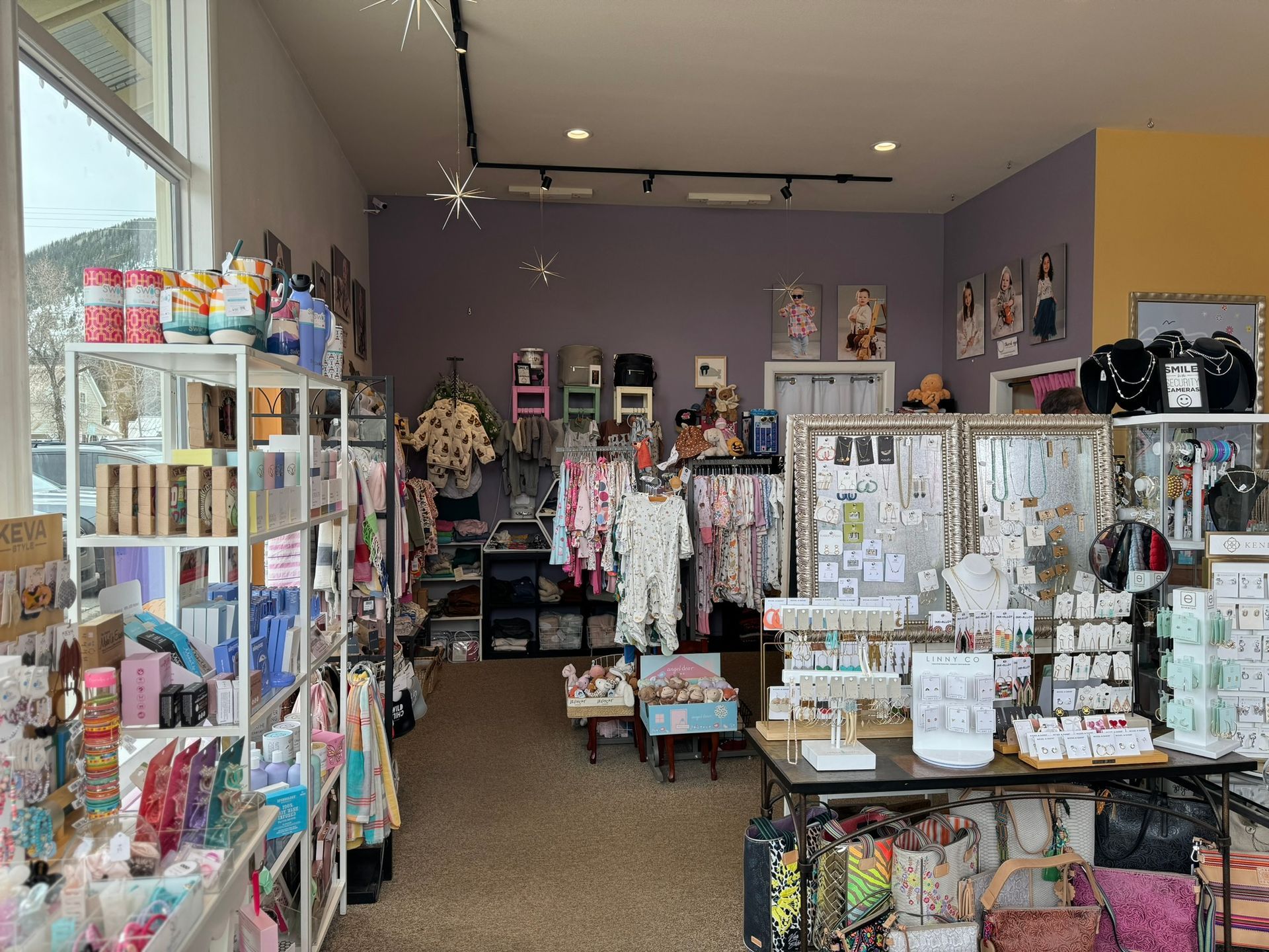 A store filled with lots of clothes and jewelry.