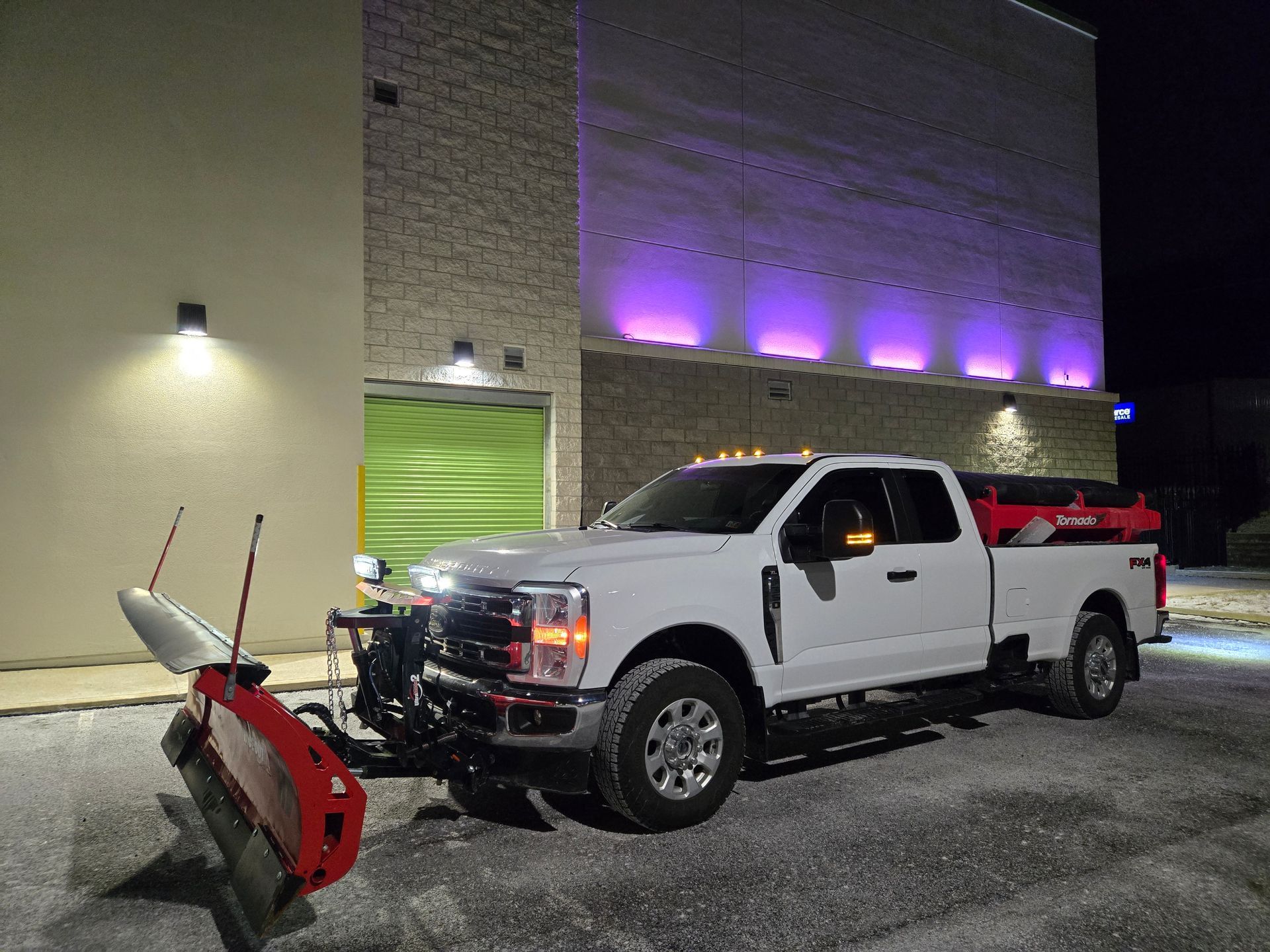 A white truck with a snow plow attached to it — Bridgeville, PA — MC Landscaping
