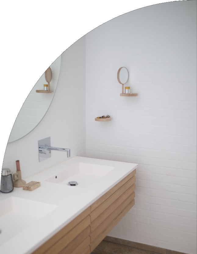 Dual vanity sink with subway tile backsplash by We Do Construction