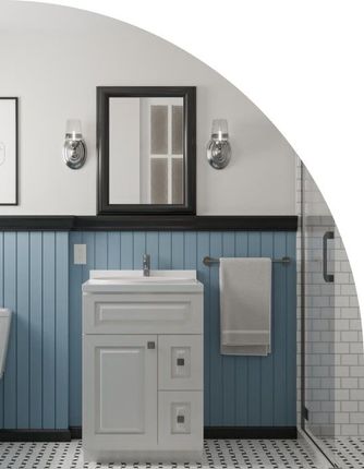 Bathroom with blue wainscoting, white vanity, black framed mirror, chrome fixtures, and white subway tile shower.