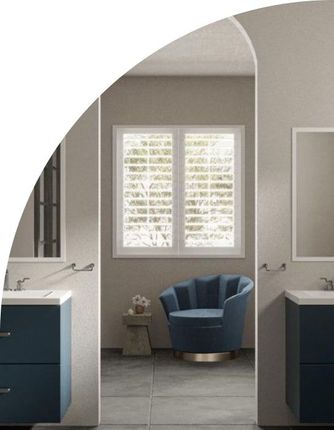 Bathroom with blue vanities, armchair, and window with shutters.