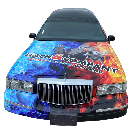 A funeral car with the word company on the hood