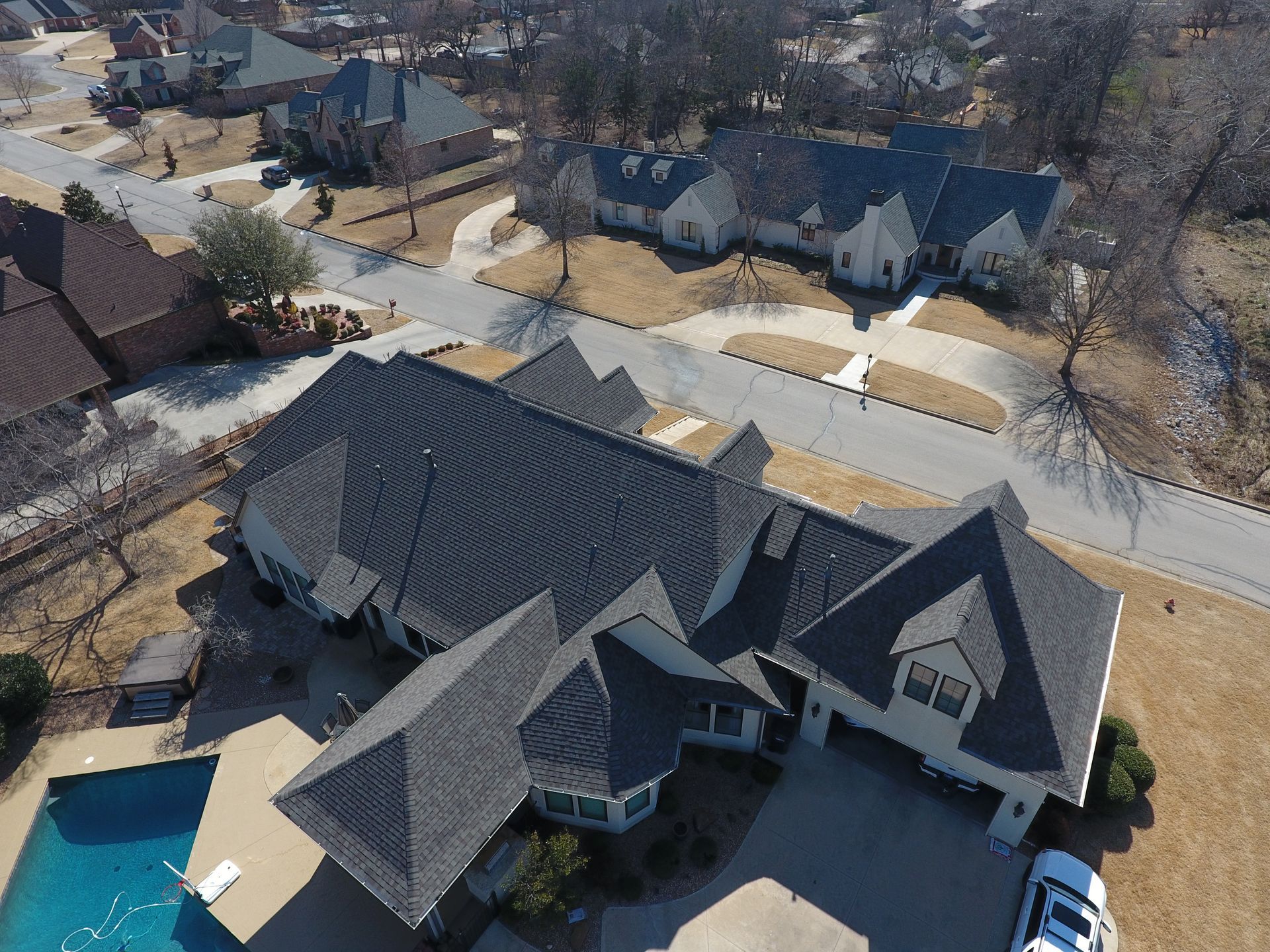There is a chimney on the roof of a house.