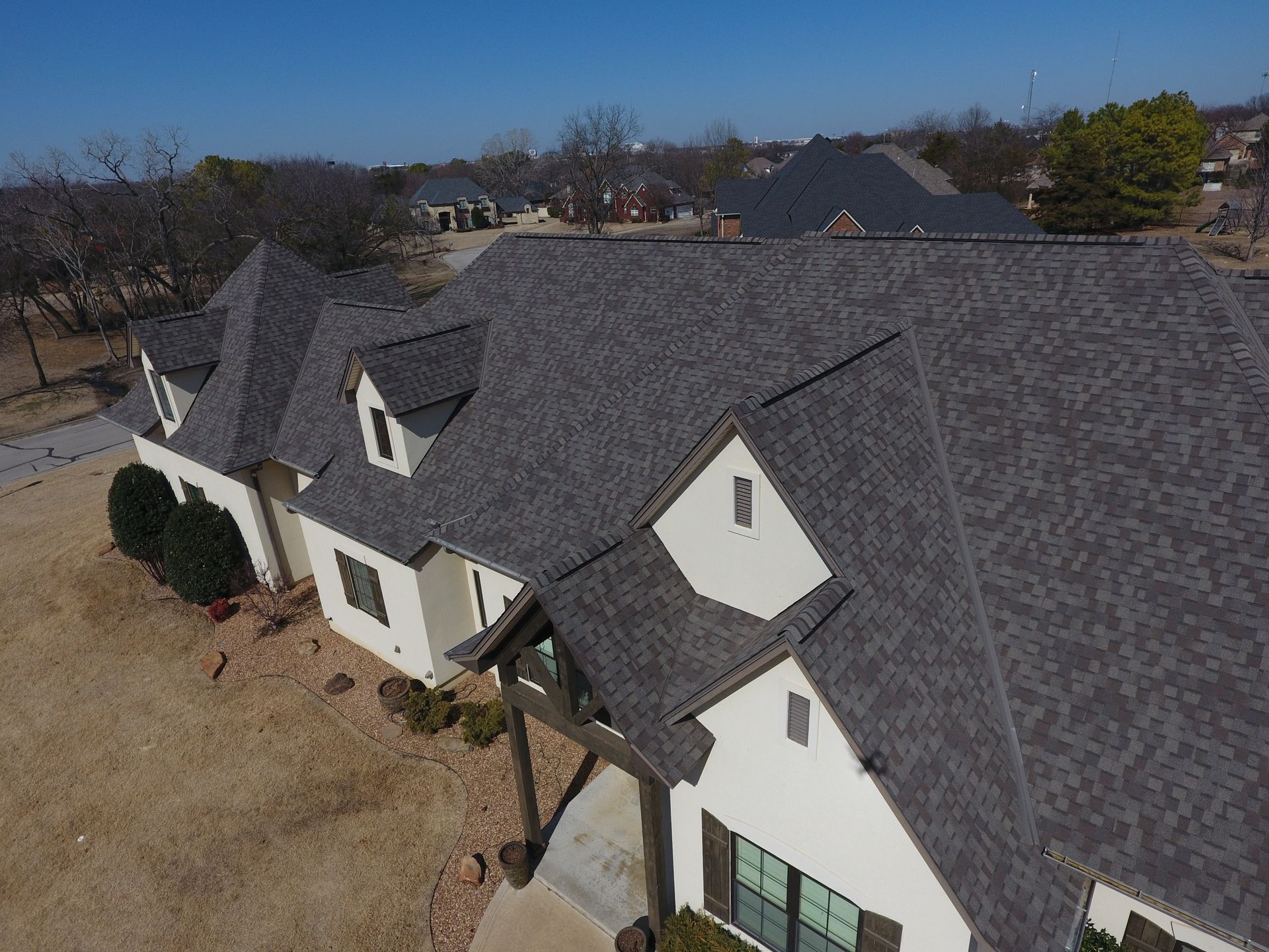 An aerial view of a house with a roof that is being built.