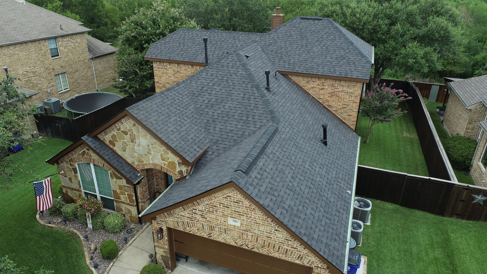 There is a chimney on the roof of a house.