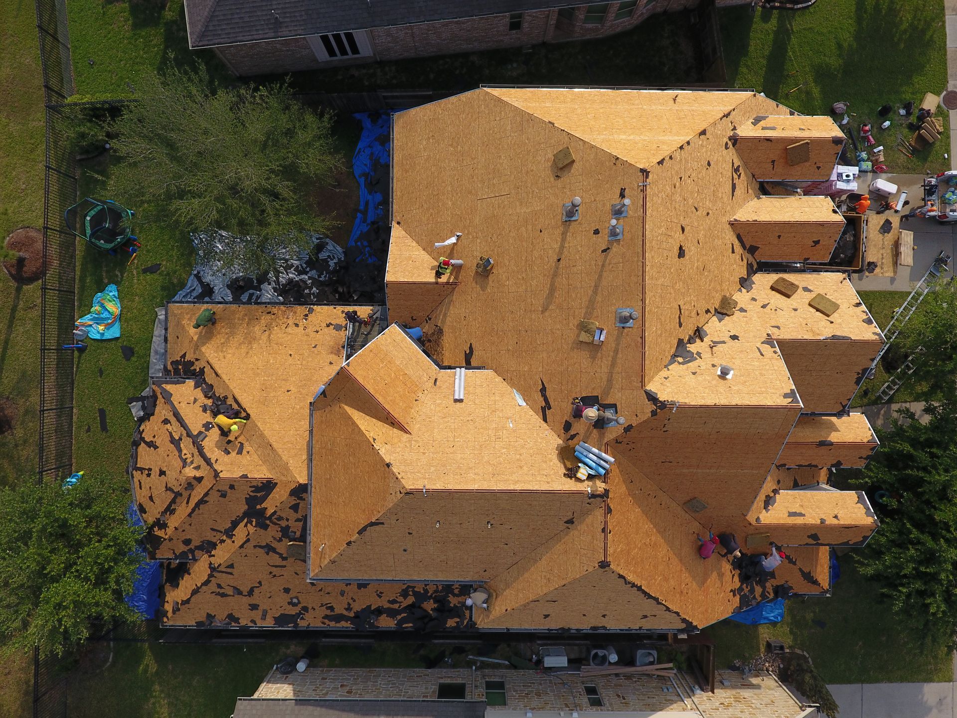 An aerial view of a large house under construction