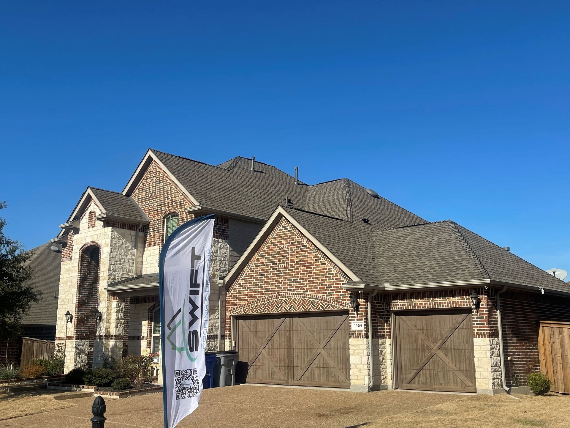 A large house with a flag in front of it.