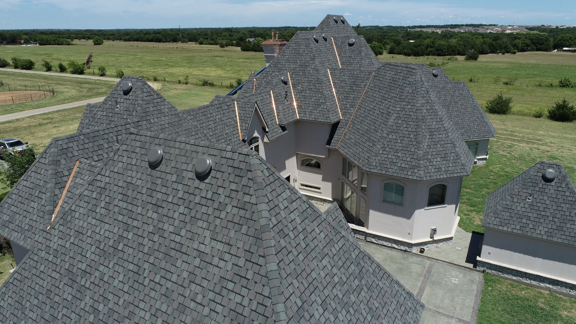 An aerial view of a house with a roof that is being built.