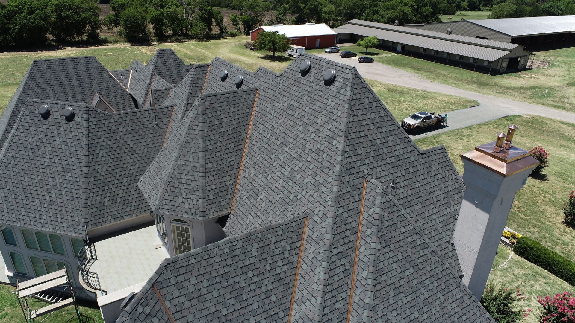 There is a chimney on the roof of a house.