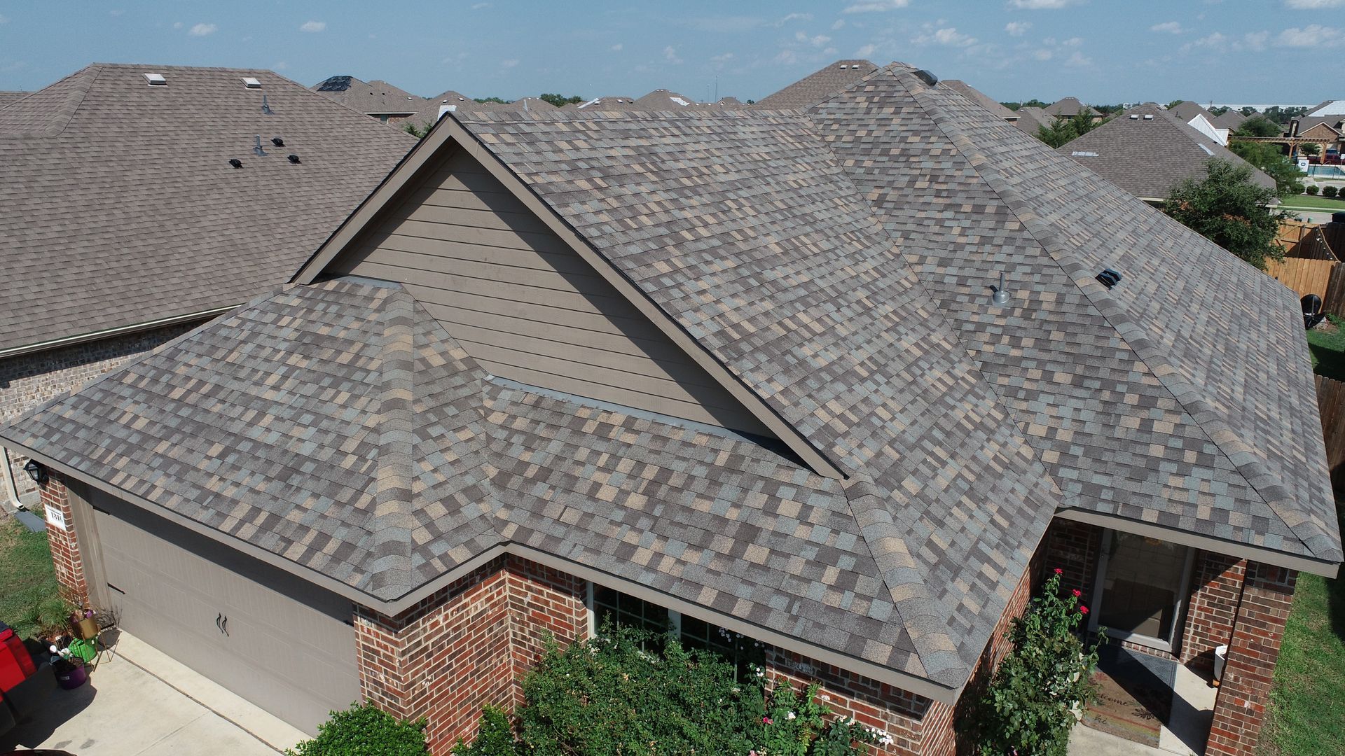 An aerial view of a house with a roof that is being built.