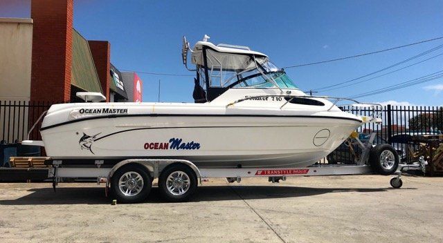 transport trailer with white boat