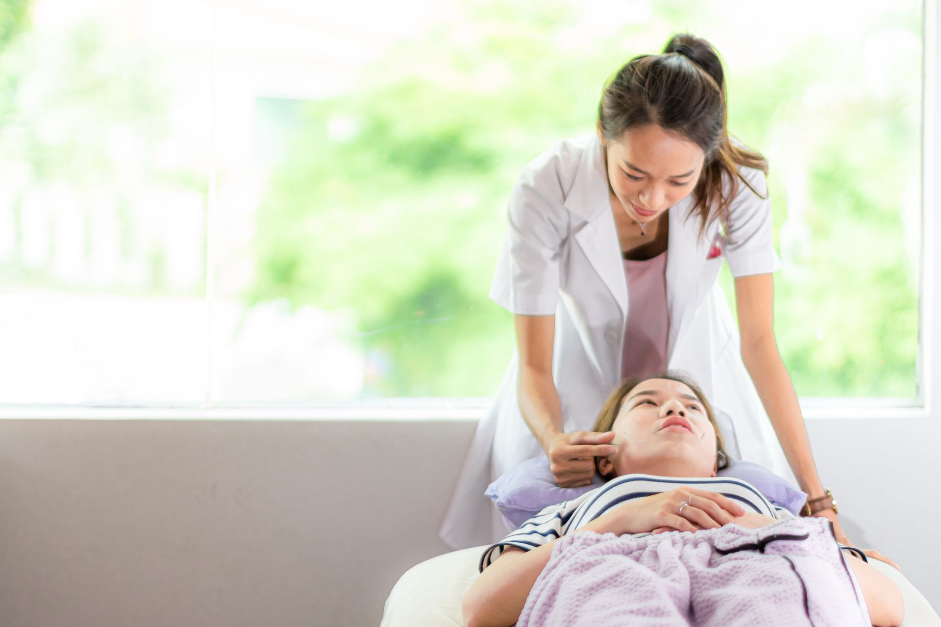 Woman Giving A Massage — Glenview, IL — Healing Spring Acupuncture Center