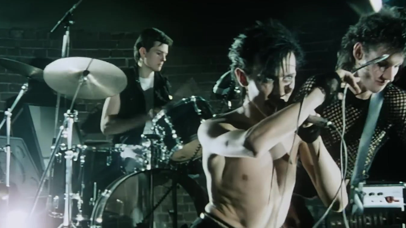 Bauhaus's cover of Peter Murphy of the goth band Bauhaus in a still from their music video for their cover of David Bowie's