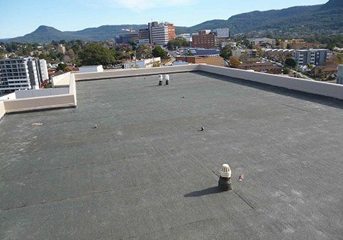 Building Roof — Wollongong, NSW — Longlife Waterproofing