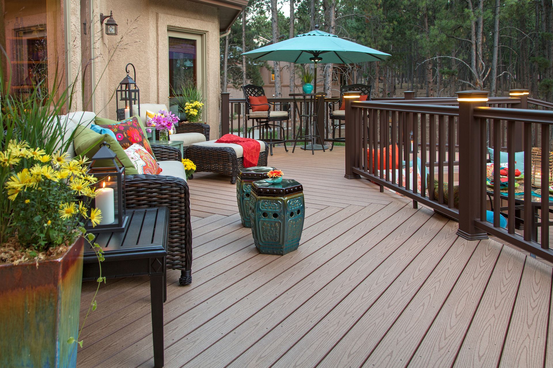 Outdoor deck with seating, umbrella, and decorative elements.