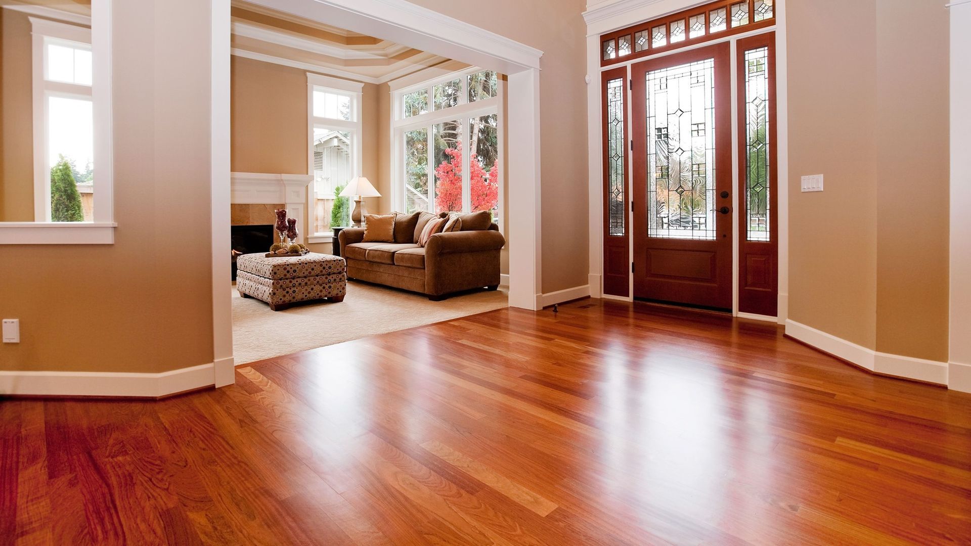 A living room with hardwood floors and a couch.