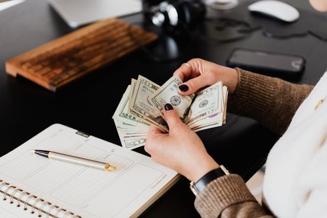 Person counting money